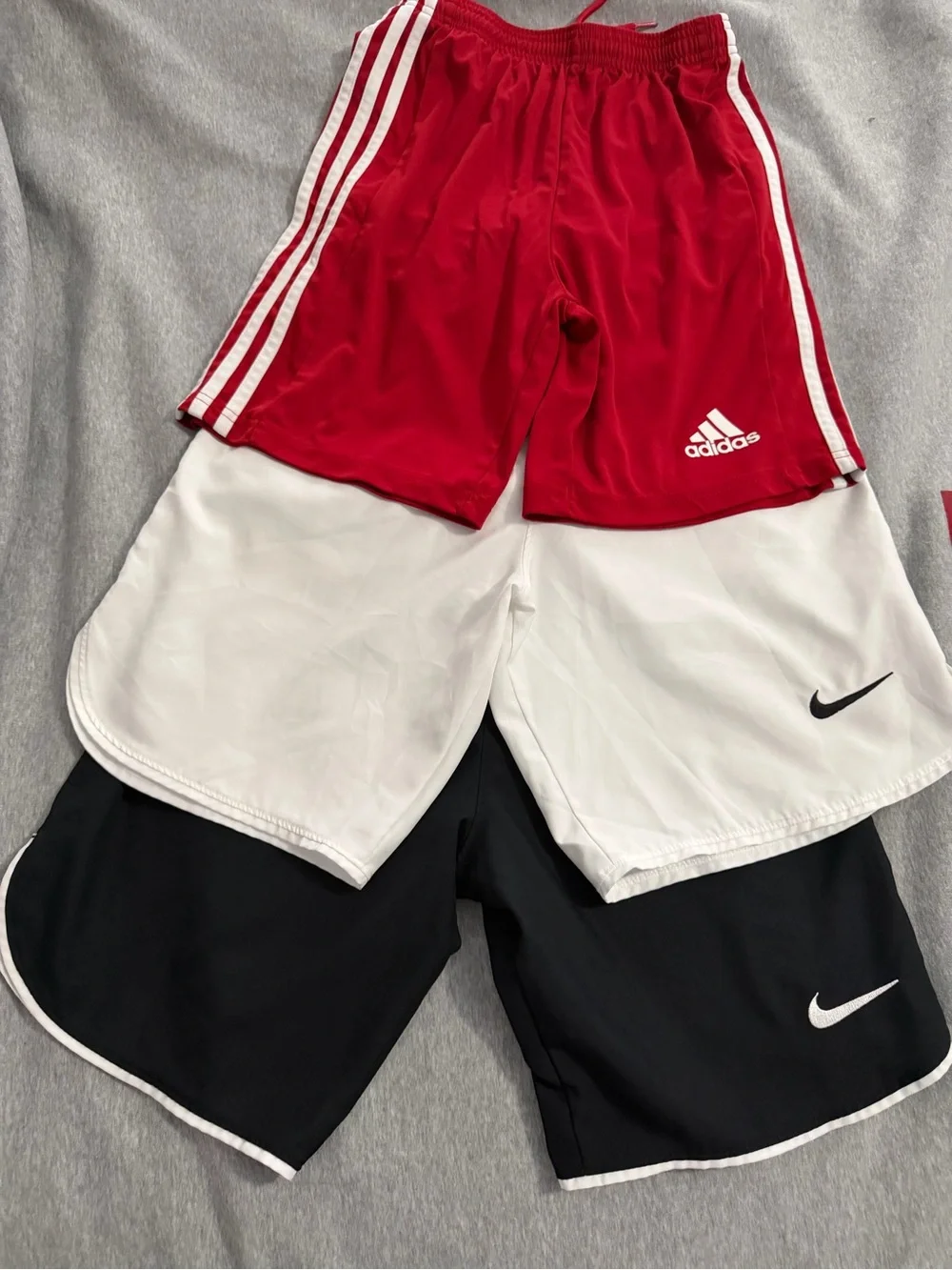 3 Stack - Nike Black and White Athletic/Soccer Shorts and Adidas Red shorts
